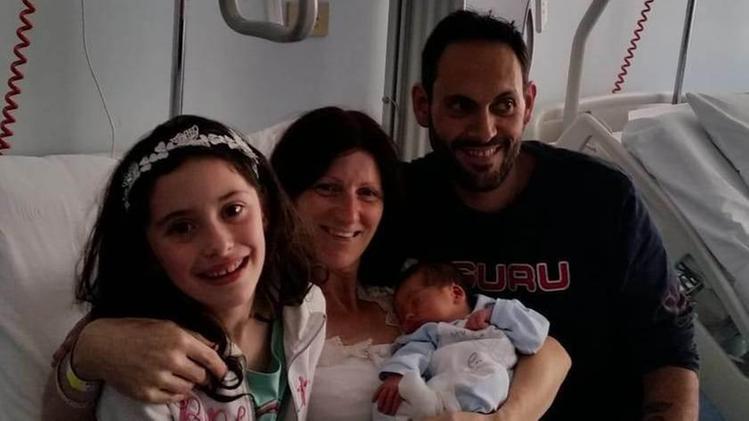 Il piccolo Matteo Ruffini con la sorella Valentina e i genitori